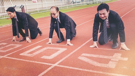 group of business people ready to start the race in track. business challenge concept.