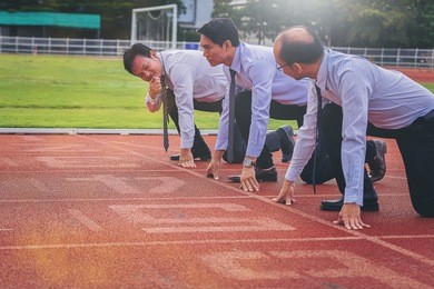 group of business people ready to start the race in track. business challenge concept.