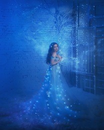 fantastic snow queen in a luxurious dress, in an ice room. the interior fills with magic, her dress sparkles and glows. artistic photography