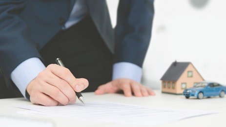 insurance agent in office. home and car safety care concept