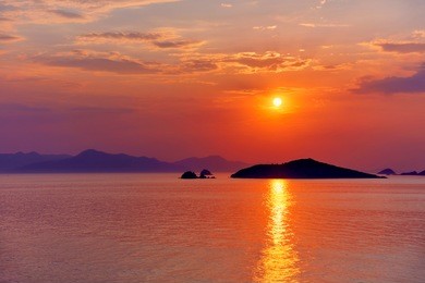 beautiful seascape at sunset over the sea with blue and pink pastel colors at turgutreis, bodrum, turkey