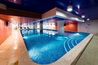 private swimming pool for relaxation, with beautiful lighting.