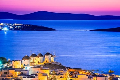mykonos, greece. kato mili windmill at sunset and aegean sea, mikonos, cyclades islands.