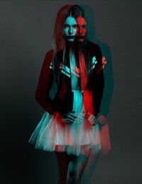 young girl model with a slavic appearance with long blond hair in a sports blazer and ballet skirt looks in the lens; photo processed in the style of three-dimensional graphics