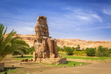 the colossi of memnon, two massive stone statues of pharaoh amenhotep iii near luxor, egypt