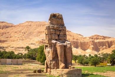 the colossi of memnon, two massive stone statues of pharaoh amenhotep iii near luxor, egypt