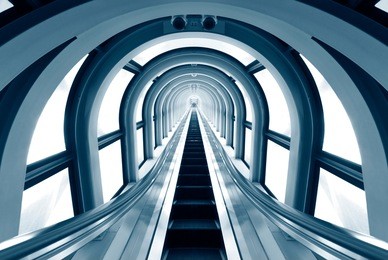 futuristic tunnel and escalator of steel and metal, interior vie