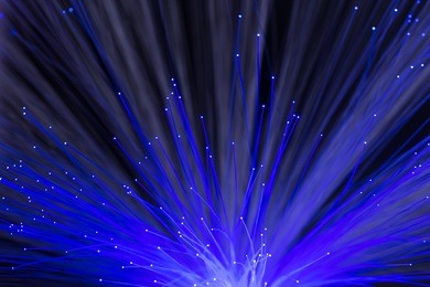 abstract background of glowing blue color optical fibers