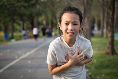 communicates the symptoms of heart disease,immediately,asian girl in the park