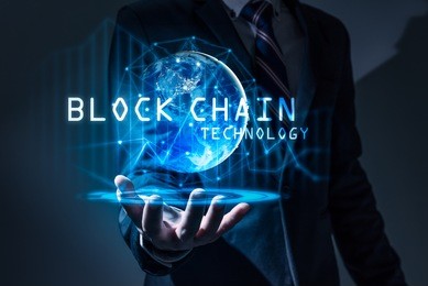 the abstract image of the business man hold the blockchain hologram on hand and element of this image furnished by nasa. the concept of cryptocurrency, blockchain, internet of things and future life