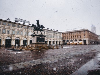 vintage looking piazza san carlo royal square in turin (torino), italy under the snow