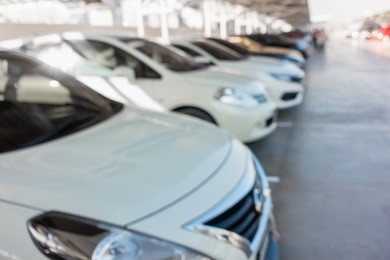 abstract blurred of car parking lot in department store.