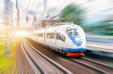 high speed train rides at high speed at the railway station in the city