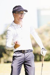 asian men playing golf. men play hole in one golf while standing on field