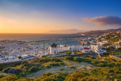 aerial panoramic view of upper chora in mykonos, greece at sunset. colorful sunset over mykonos, cyclades, greece