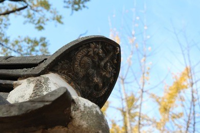 traditional korean ceramic roof tile with dragon image at gyeongju yangdong folk village, south korea