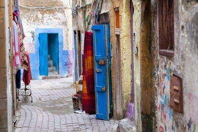narrow colorful street in the old medina of essaouira in morocco