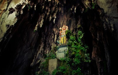 statue of buddha in cave batu caves, malaysia