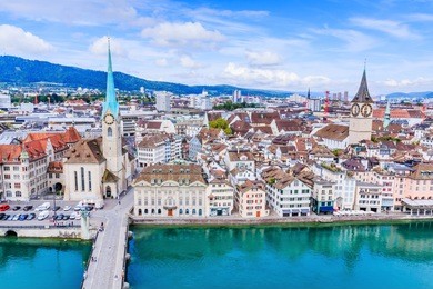 zurich, switzerland. view of historic zurich city center with famous fraumunster church, limmat river and zurich lake from grossmunster church.
