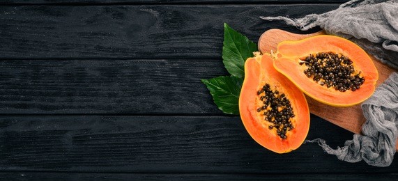papaya. tropical fruits. on a wooden background. top view. copy space.