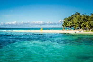 august 2014. view on managaha park island from saipan island beach. 
