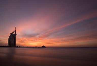dubai, uae - jan 29, 2018: dubai beach during a stunning colorful sunset as viewed from the public beach. 