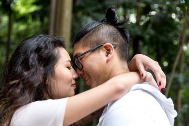 romantic young asian couple kissing