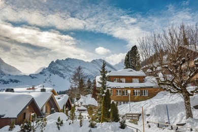 beautiful sunny winter day in village of murren in swiss alps. village is popular tourist destination