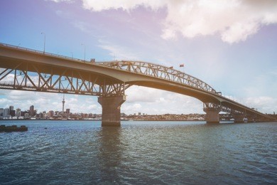 auckland harbour bridge in auckland, new zealand, shot from northcote point. the bridge joins st marys bay on the auckland city side with northcote on the north shore side.