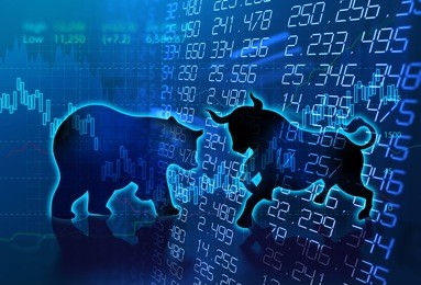 silhouette form of bull and bear on financial stock market graph represent stock market risk or random trend investment
