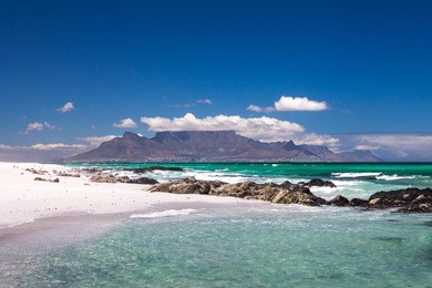 cape town scenic view of table mountain from blouberg with blue sky and white clouds in summer