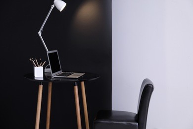 living room interior with comfortable workplace near wall