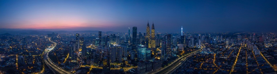 panorama aerial view in the middle of kuala lumpur cityscape skyline .night scene before sunrise , malaysia .