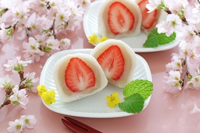 japanese traditional sweets, strawberry daifuku with beautiful cherry blossoms