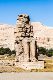 the colossi of memnon are two massive stone statues of the pharaoh amenhotep iii, luxor, luxor governorate