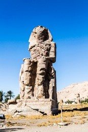 the colossi of memnon are two massive stone statues of the pharaoh amenhotep iii, luxor, luxor governorate