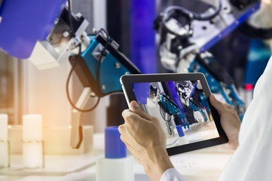 industry 4.0 robot concept .engineers use laptop computers for machine maintenance, automation tools, robot arm at the factory.

