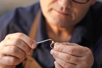 jeweler working in workshop, closeup