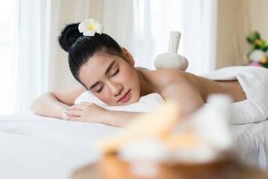 young beautiful asian woman relaxing in the spa massage