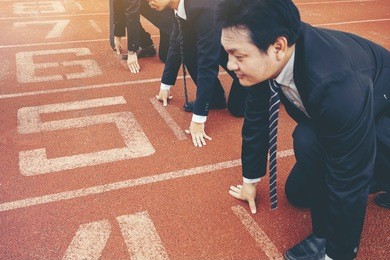 group of business people in suit uniform ready to start the race in track. business challenge concept.
