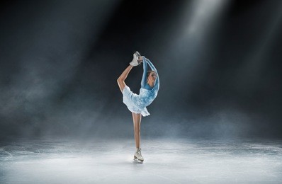 girl skating at ice arena
