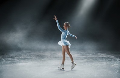 girl skating at ice arena