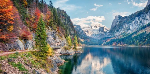 beautiful autumn panorama of vorderer ( gosausee ) lake with dachstein glacier on background. splendid morning view of austrian alps, upper austria, europe. orton effect.