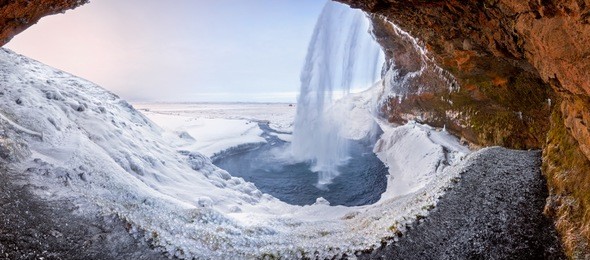 godafoss frozen waterfall during winter at sunrise. north iceland.