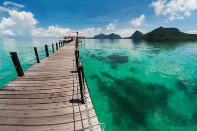 the majestic view of corals reef and islands seen from the jetty of bohey dulang island, sabah, malaysia.