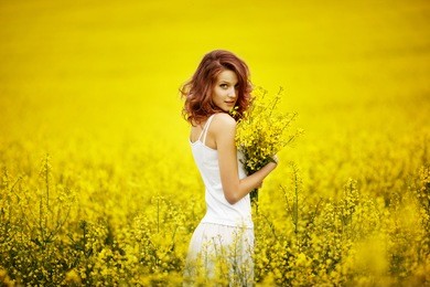 young beautiful girl in the field