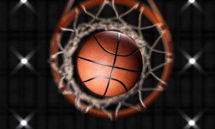 3d render basketball passing hoop with spotlight into stadium