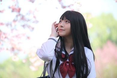 japanese school girl dress with sakura flower nature walkway