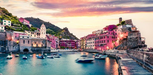 one of the five towns that make up the cinque terre region - vernazza. great spring sunrise in liguria, italy, europe. splendid seascape of mediterranean sea. traveling concept background.