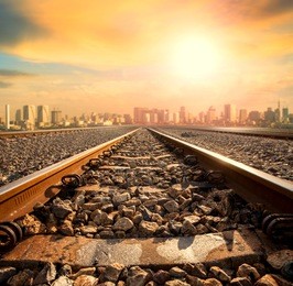 perspective of railway track forward to building in city